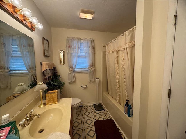 full bathroom with shower / tub combo, toilet, and sink