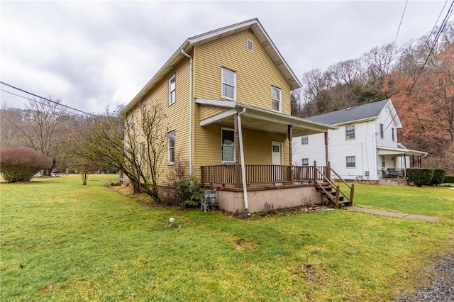 view of front of home with a porch and a front lawn