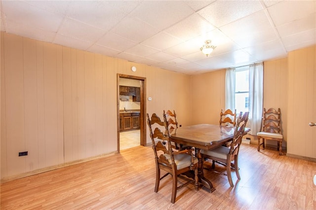 dining space featuring light wood-type flooring