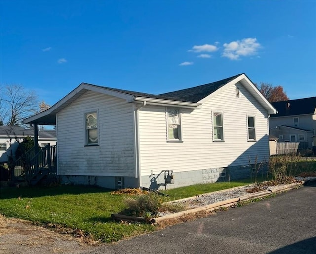 view of property exterior featuring a yard