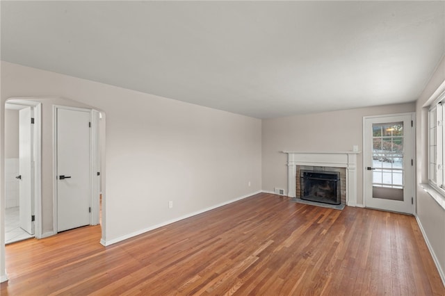 unfurnished living room with light hardwood / wood-style flooring