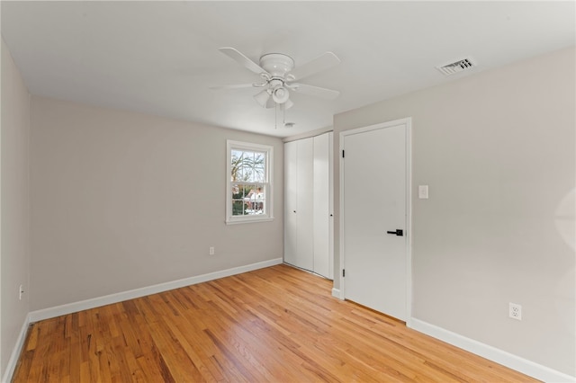 unfurnished bedroom featuring ceiling fan and light hardwood / wood-style flooring