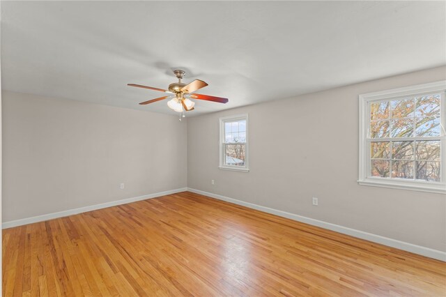 unfurnished room with ceiling fan and light hardwood / wood-style floors