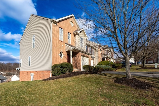 view of property exterior with brick siding and a lawn