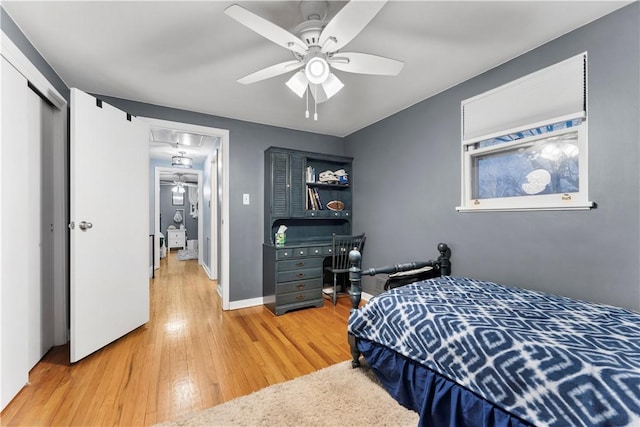 bedroom with wood-type flooring and ceiling fan