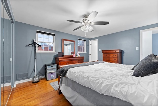 bedroom with wood-type flooring and ceiling fan