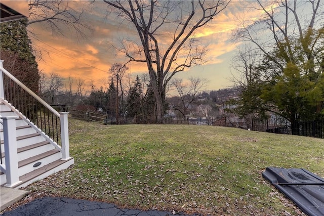 view of yard at dusk