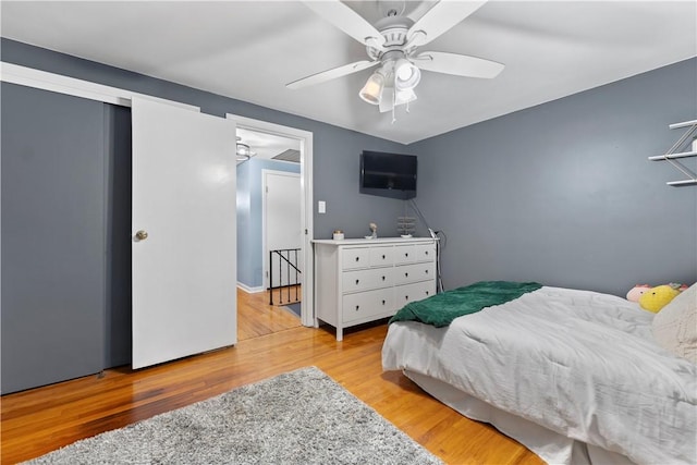 bedroom featuring ceiling fan and light hardwood / wood-style floors