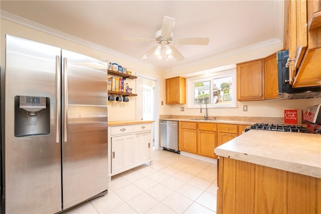 kitchen with sink, crown molding, ceiling fan, appliances with stainless steel finishes, and white cabinetry