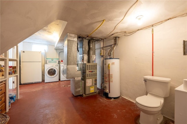 basement featuring heating unit, washing machine and dryer, water heater, and white fridge