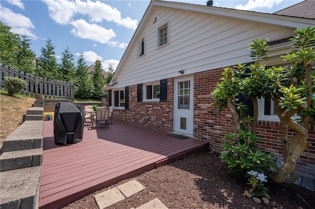 wooden deck featuring grilling area