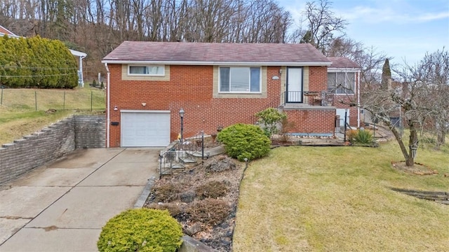 view of front facade with a garage and a front lawn