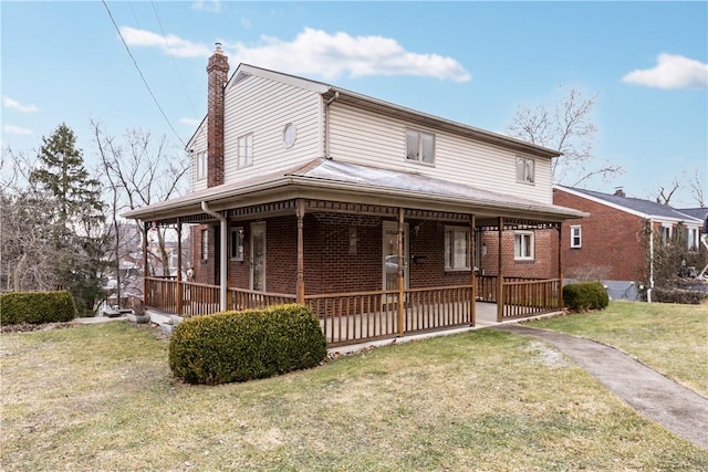 view of front of house with a porch and a front lawn