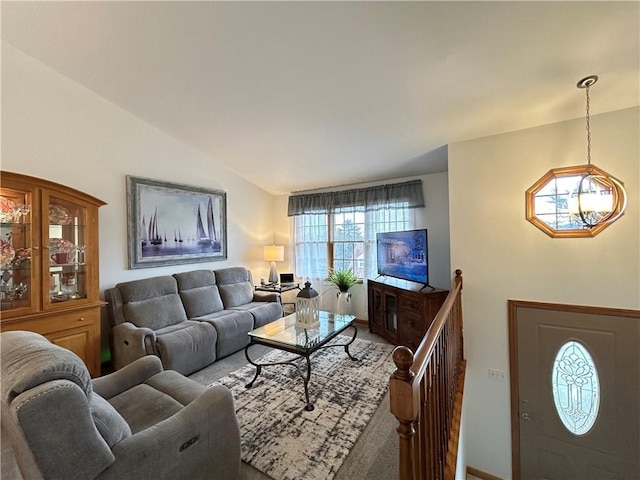 living room featuring vaulted ceiling