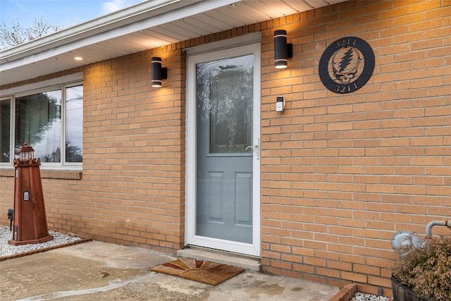 doorway to property with a patio