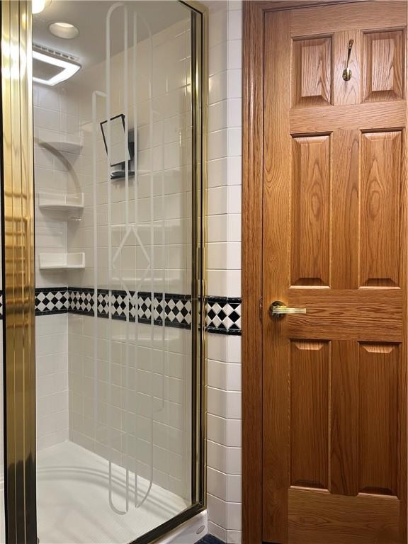 bathroom with a stall shower