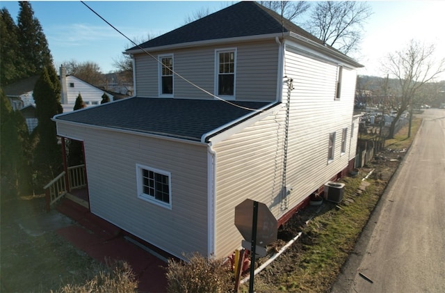 view of side of home with cooling unit