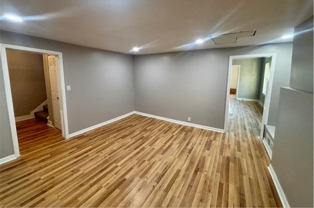 spare room with light hardwood / wood-style flooring