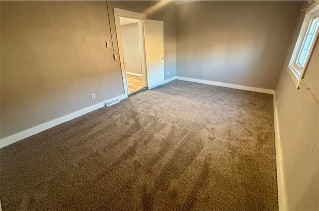 unfurnished room featuring carpet flooring