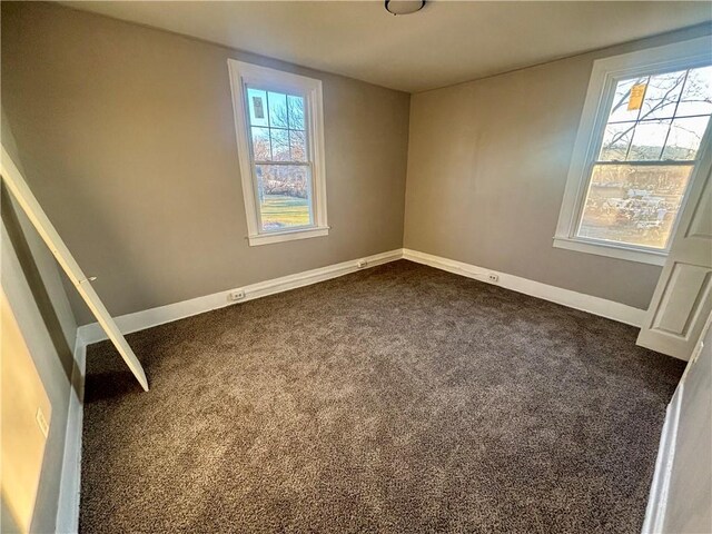 30 1st St, Leetsdale, PA 15056 - empty room with dark carpet, baseboards, and healthy amount of natural light