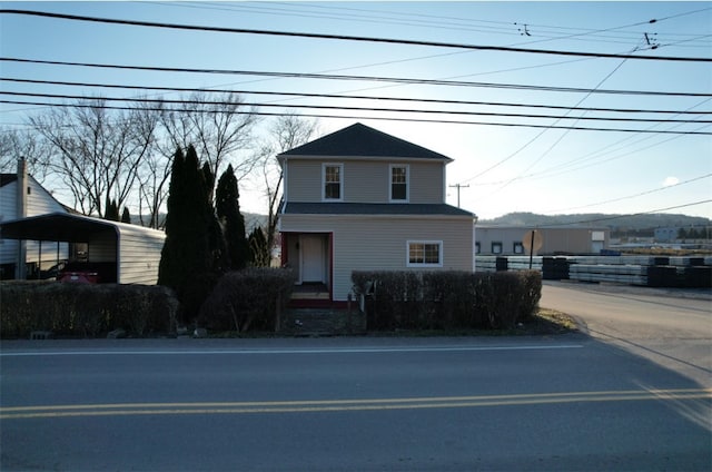 view of front facade with a carport