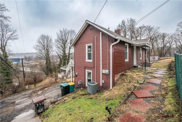 view of property exterior with cooling unit