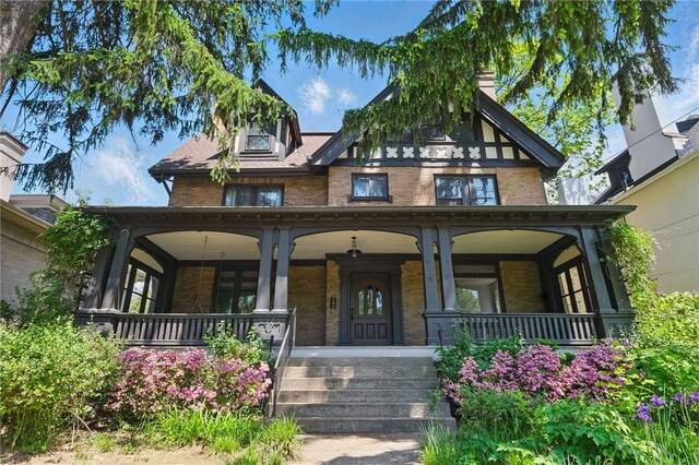 5575 Hampton St, Highland Park, PA 15206 - view of exterior entry featuring brick siding and covered porch