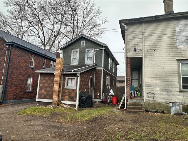 616 15th St, Beaver Falls, PA 15010 - rear view of house featuring stone siding