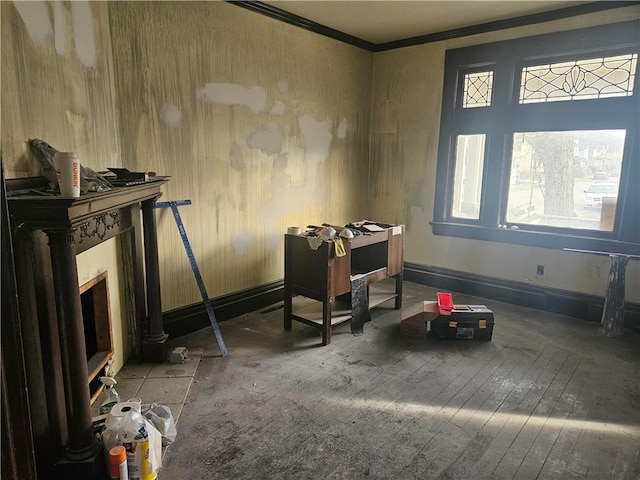 misc room featuring hardwood / wood-style flooring, a wealth of natural light, and ornamental molding