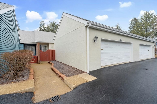 view of side of property featuring a garage