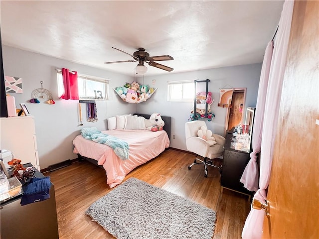 bedroom featuring hardwood / wood-style floors and ceiling fan