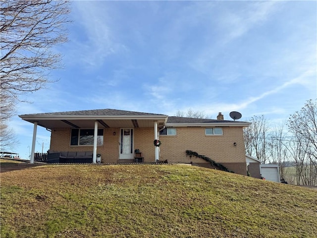 view of front of home with a porch and a front lawn