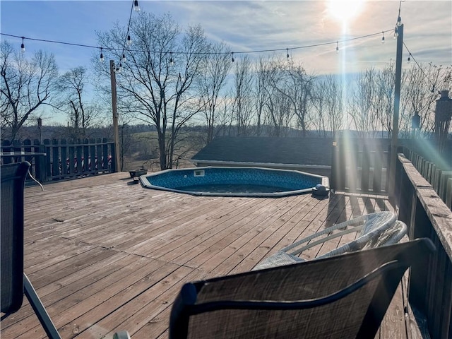 view of swimming pool with a deck