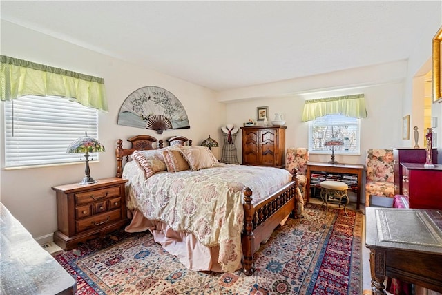 bedroom featuring multiple windows