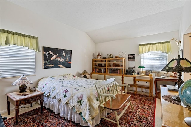 bedroom featuring vaulted ceiling, a textured ceiling, and carpet flooring