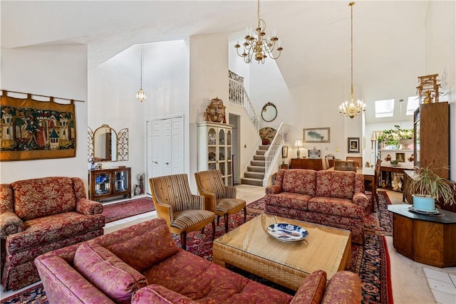 living room with a towering ceiling and a chandelier