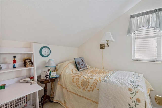 bedroom featuring vaulted ceiling