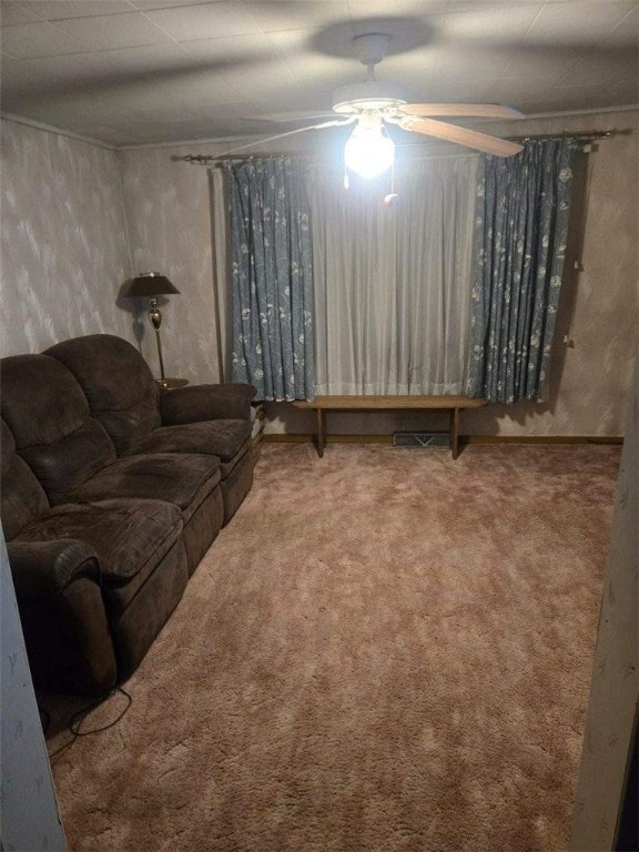 carpeted living room featuring ceiling fan