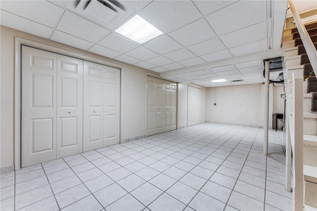 basement featuring a paneled ceiling