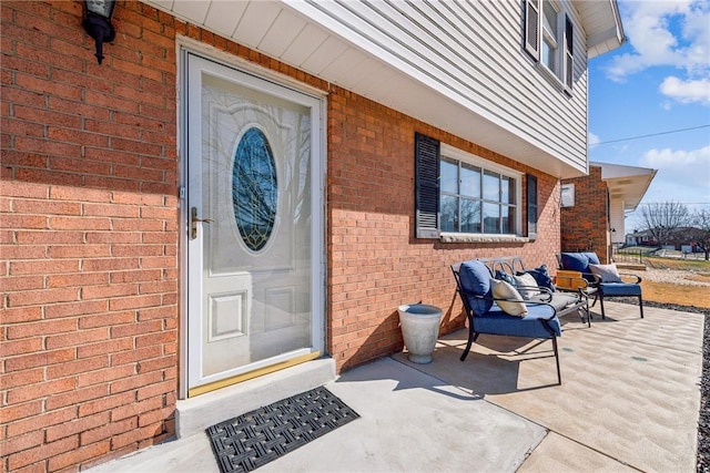 doorway to property featuring a patio