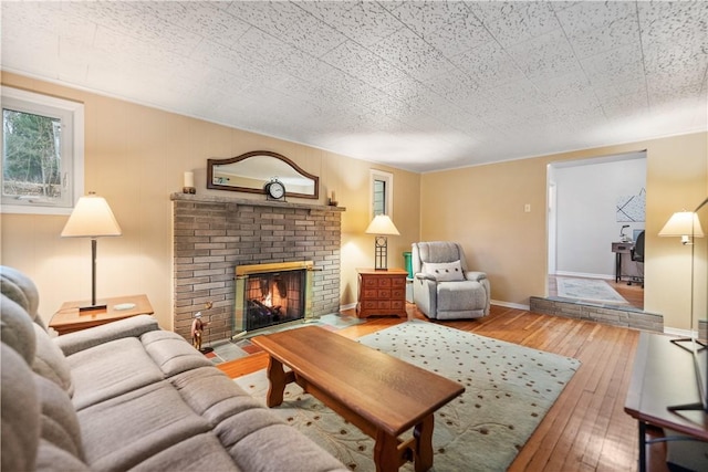 living room featuring a fireplace and hardwood / wood-style floors