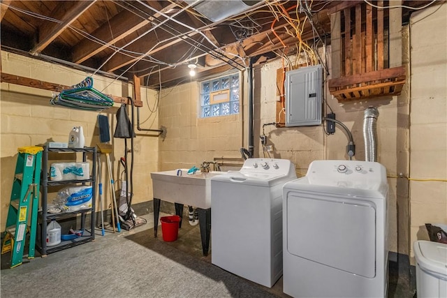 clothes washing area with electric panel and washing machine and clothes dryer