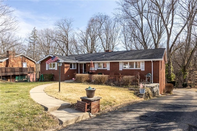 ranch-style home with a front yard