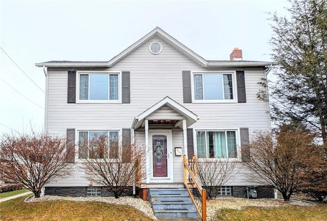 view of front of house with a front lawn