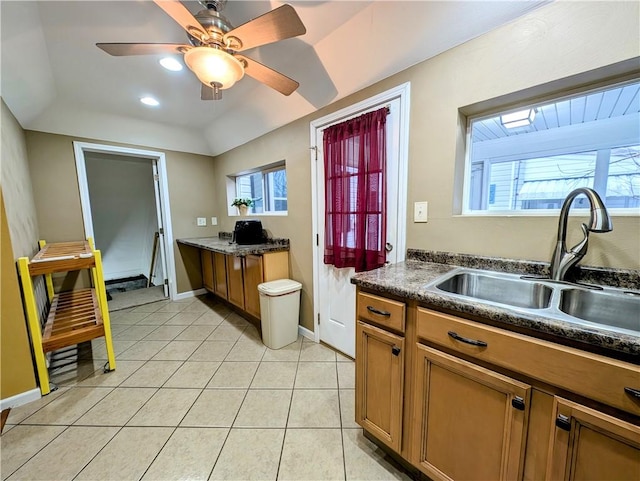 kitchen featuring sink, light tile patterned floors, and ceiling fan