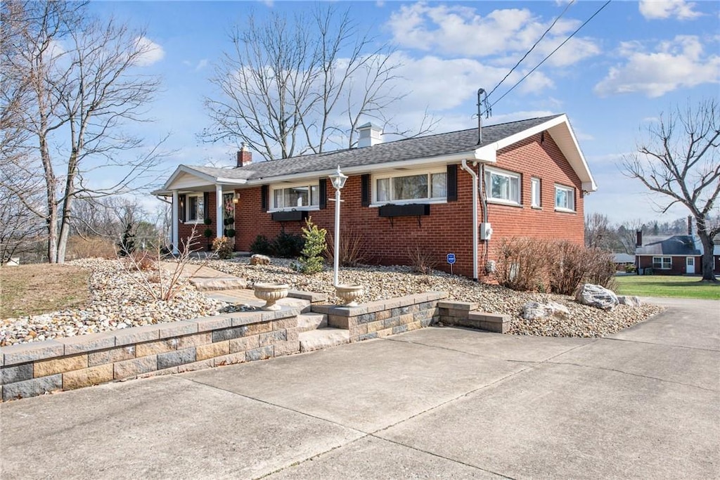 ranch-style home with covered porch