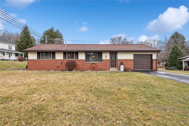 ranch-style home featuring a garage and a front lawn