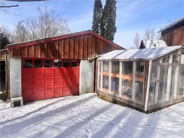 view of snow covered garage