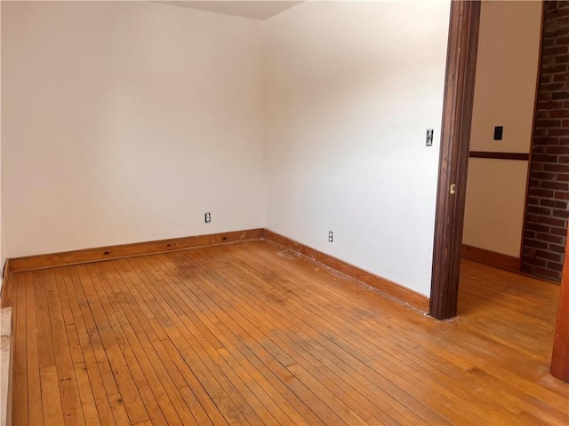 unfurnished room with light wood-type flooring