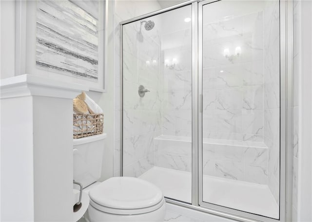 bathroom with an enclosed shower and toilet